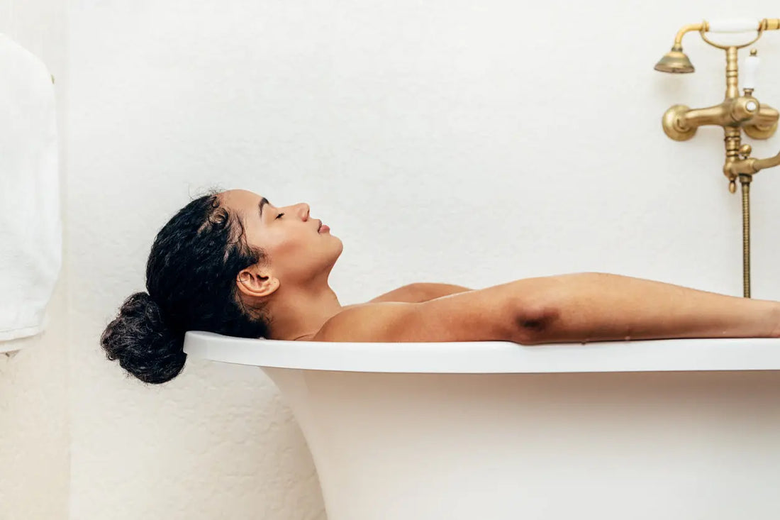 Woman in Himalayan salt sole bath